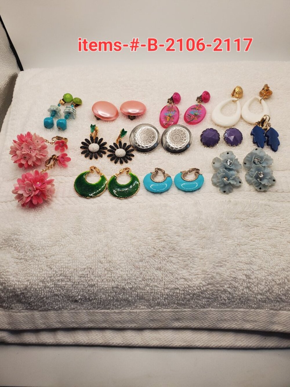 12 Pair of clip on earrings, items # B-2106-2117,.  wt. 123 grams.